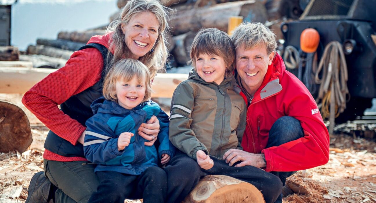 A family posing for the camera while travelling together.