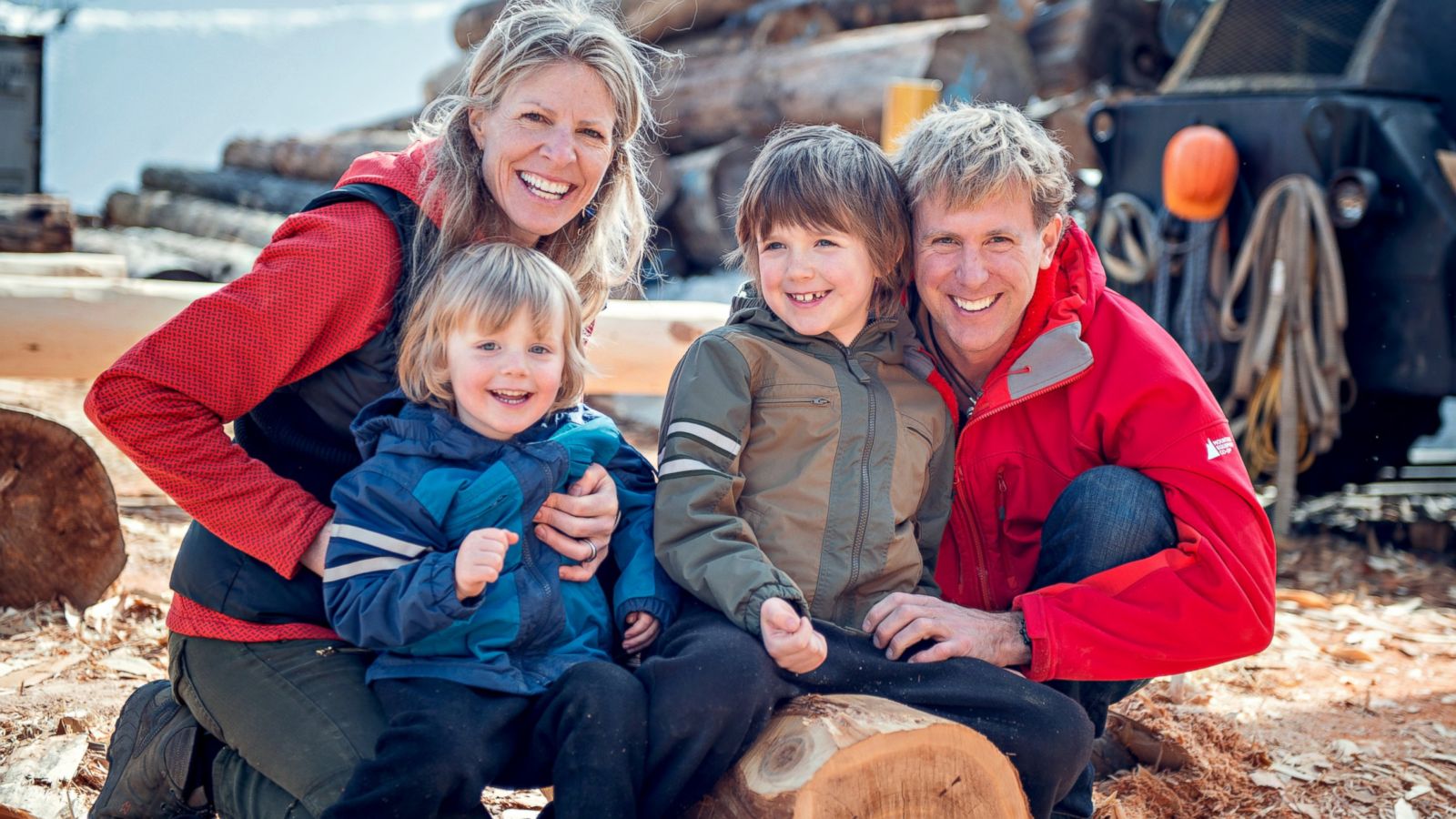 A family posing for the camera while travelling together.