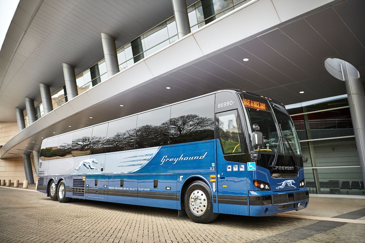 A Greyhound bus waiting for its passengers.